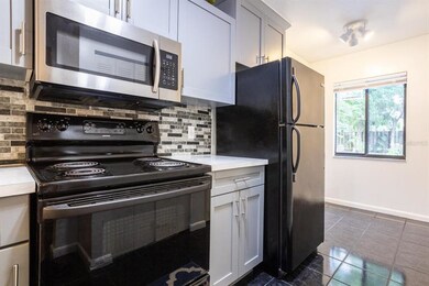 Beautiful Backsplash, Stainless Microwave & Hardwa