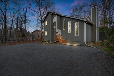 The house is set back from the street for added pr
