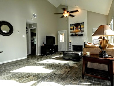 Tons of natural light.  Living area with wood fini