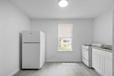 This photo showcases a compact, bright room with l