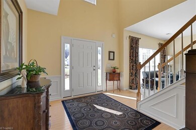 Entry with hardwood flooring and plenty of light.