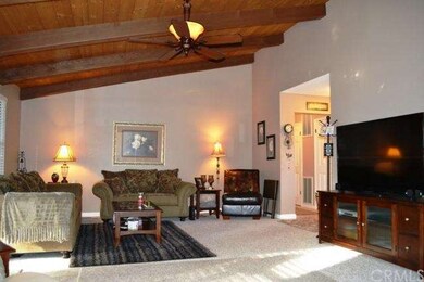 Soaring open beamed ceiling in the living room, wi