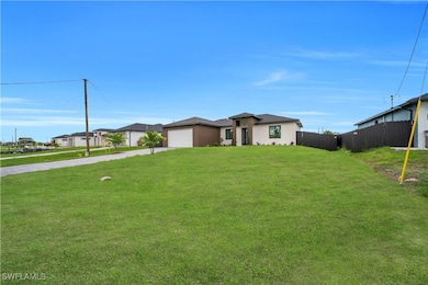 View of front of property featuring driveway, stuc