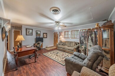 Living room with wood-type flooring, ornamental mo