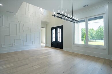 Entryway featuring light wood-style floors and french doors