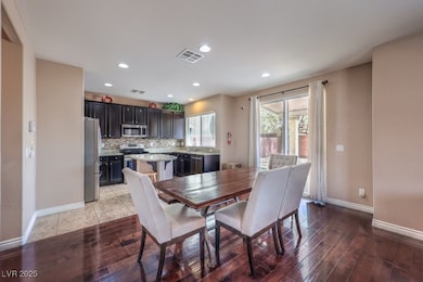 Dining area located between kitchen and family roo
