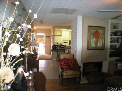Living room looking into the kitchen and dining ro