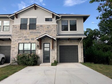 View of front of home with stone siding, stucco s