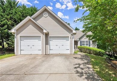 View of front of home featuring driveway and a garage