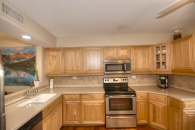 The kitchen has a see through to the living room. 