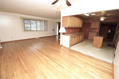 Dining room featuring ceiling fan and hardwood flooring
