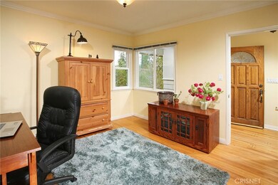 2 additional guest rooms with crown molding, lighting on dimmers, closets with built-in drawers and shelves and gleaming hardwood floors.  One bedroom is currently used as a private office.