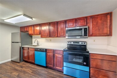 Kitchen with stainless steel appliances, a sink, d