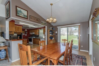 Vaulted Dining Area with wood-look laminate floor 
