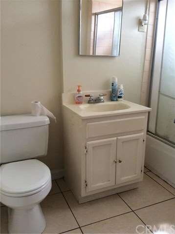 Tile floor bathroom  and new vanity.