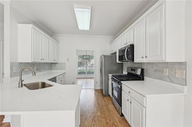 Kitchen with appliances with stainless steel finis