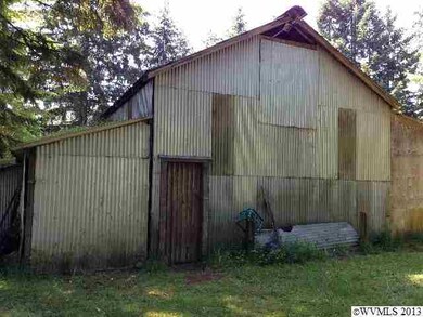 Includes 3 stalls, with room for hay storage. Powe