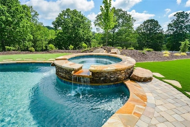 View of swimming pool with a lawn, an in ground ho