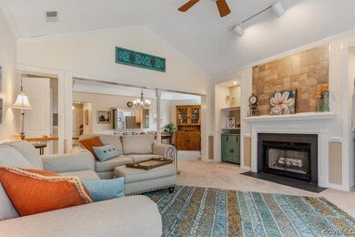 Living room with light carpet, ceiling fan with no