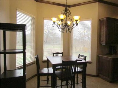 Dining Room. Ceramic tile flooring, bay window and