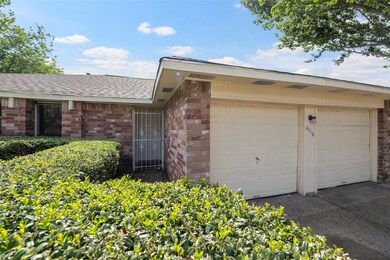 A double wide drive leads to the 2-car garage, for