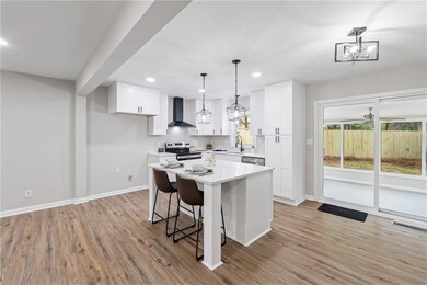 Kitchen with light countertops, visible vents, sta