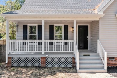 Entrance to property featuring a porch