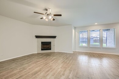 Unfurnished living room with a tile fireplace, cei