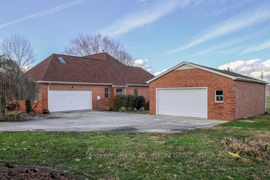 2-car attached/2-car detached garage & concrete driveway.