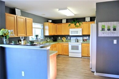 Kitchen with matching white appliances.