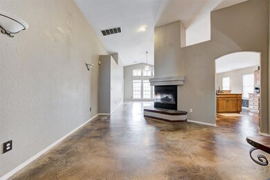 Unfurnished living room with a multi sided firepla