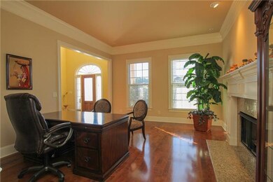 Lovely office (could be a cozy greeting room) to left of the foyer with built-in custom cabinets and a fire place
