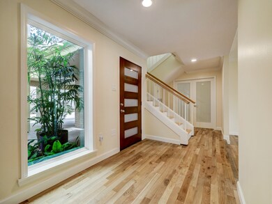 The Foyer welcomes you into this lovely home.  Whi
