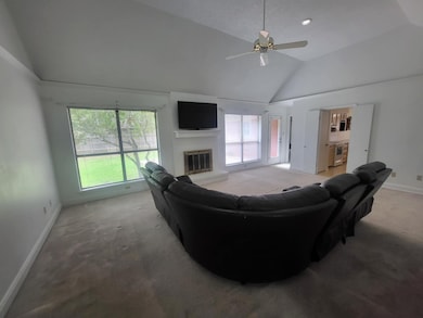 Huge family room with vaulted ceiling & a fireplac