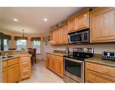 Kitchen. Beautiful solid wood cabinets and upgraded appliances.  Stove is a 5-burner stove and BRAND new!