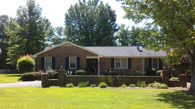 BEAUTIFUL BRICK WALL ADDS A CUSTOM TOUCH TO THE PROPERTY!