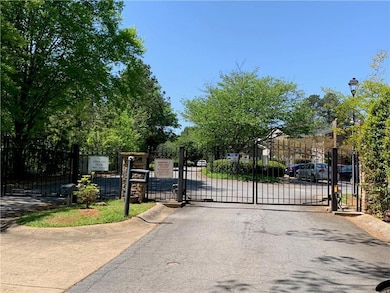 View of gate featuring fence