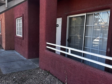 Entrance to property featuring stucco siding