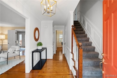 Spacious foyer features new lighting, fresh paint,