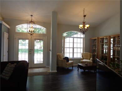 View of entrance door from living room and formal 