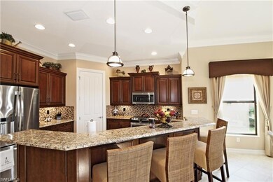 Kitchen featuring crown molding, stainless steel a