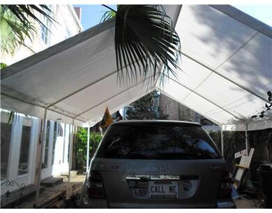 Parking Lot/Garage. put up a canopy to protect car