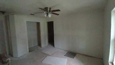 Empty room with a ceiling fan