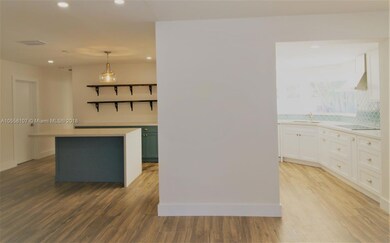 Light and bright kitchen with plenty of space for cooking/baking and entertaining or relaxing, all overlooking the gorgeous pool area.