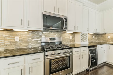 The kitchen has gleaming appliances - inc. brand n