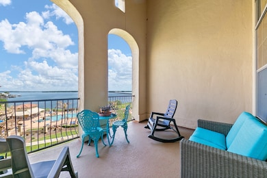 Your own private terrace with elevated views of the infinity pool and the tranquil waters of Lake Conroe