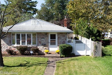 Property surrounded by mature trees.