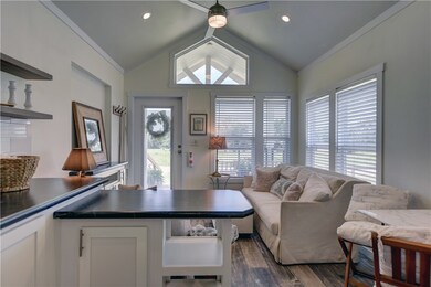 Living room with lofted ceiling, a healthy amount
