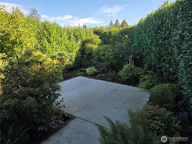 Beautiful hedgework surrounds the property