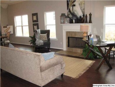 Beautiful fireplace with coordinating stone surrou